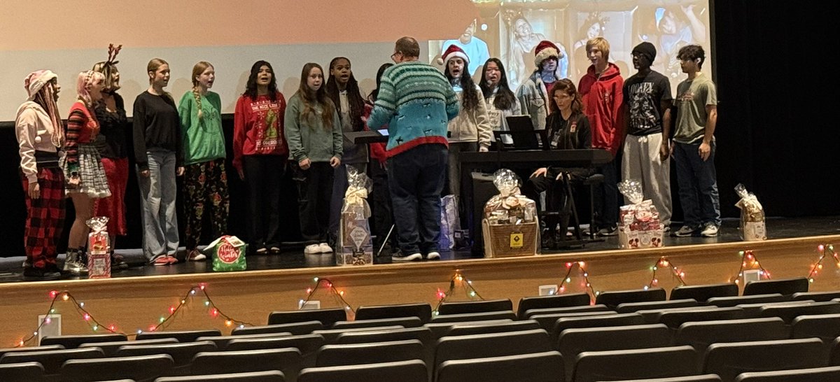Enjoying a performance from our school choir at our staff meeting today