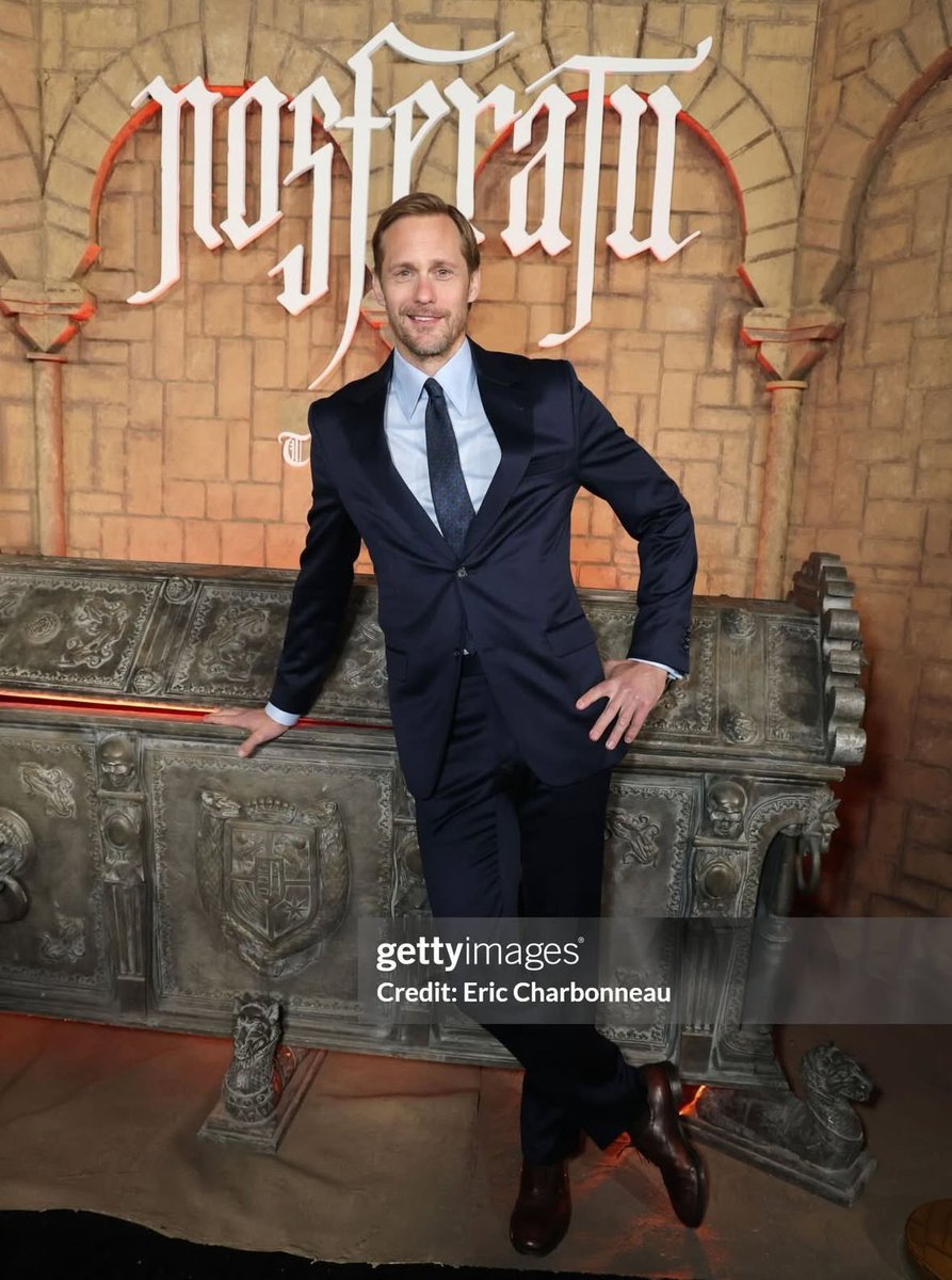 he looks like he was trying to steal the sarcophagus but got interrupted and had to act natural