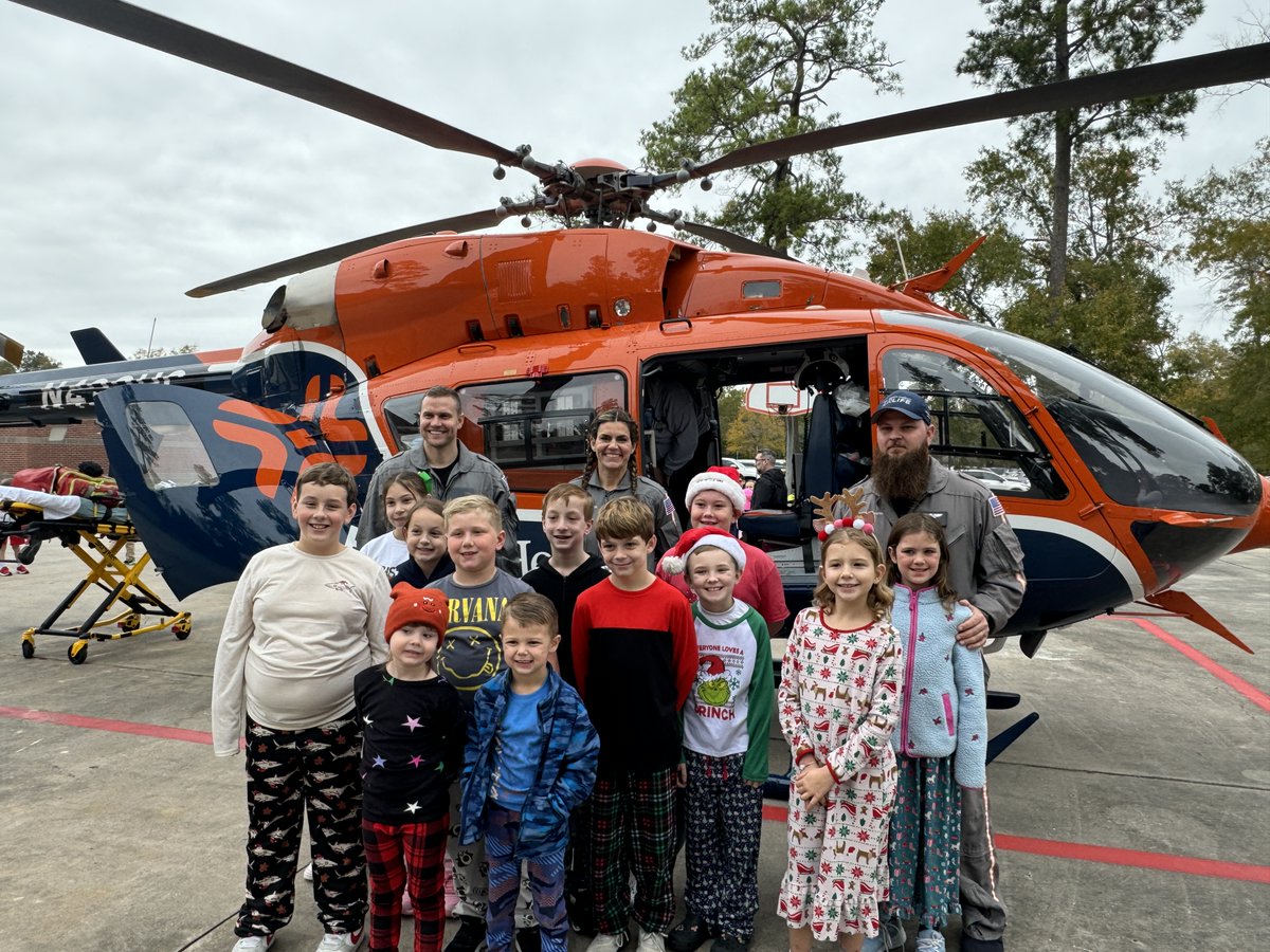 HumbleISD's tweet photo. Remember career day when you were a kid? Well you probably didn't experience one quite like Career Day at @HumbleISD_HHE! Dad Eric Behrend, who happens to be a former HHE Roadrunner, talked about his career in Ms. Montes' 3rd Grade Class, but then he FLEW IN with his work vehicle! Eric is a helicopter pilot for @HCAHouston Air Life. Students got to tour the helicopter and learned all about flying EMS care. How cool is that?! #ShineOn💫