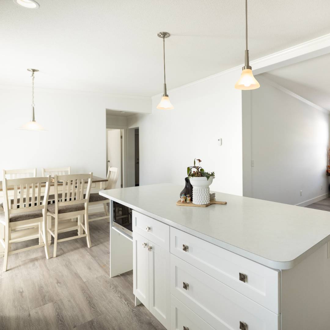 Stunning 3-bed, 2-bath home with a modern kitchen and sprawling deck. Primary suite has a walk-in closet and a 5-piece ensuite with dual vanities.  This home has 2 more bedrooms, another full bath bath, and a clever foyer that doubles as a laundry space, and ample parking.