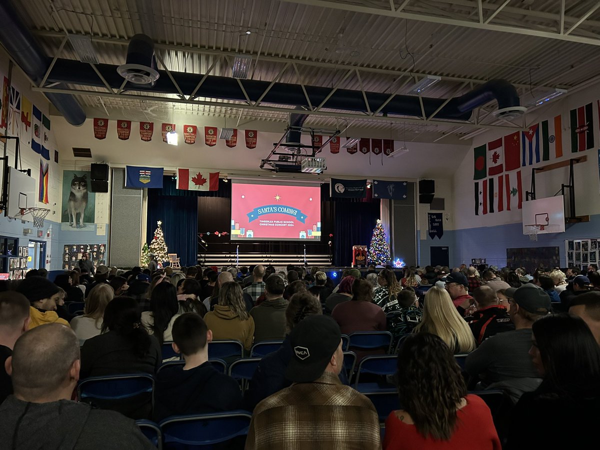 SBarr2's tweet photo. Another packed house for the Christmas Concert at Timberlea School. Lots of excited parents and students! @FMPSD @TimberleaSchool #ymmarts https://t.co/In4QtARWaf