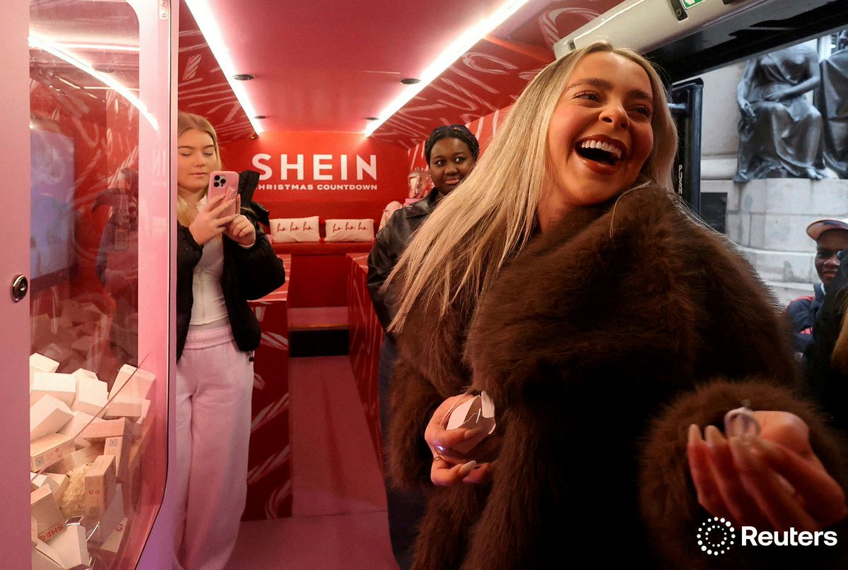 Shoppers attend fashion retailer Shein's promotional Christmas bus tour, in Manchester, Britain, December 13, 2024. Photo by Temilade Adelaja for <a href="/Reuters/">Reuters</a>