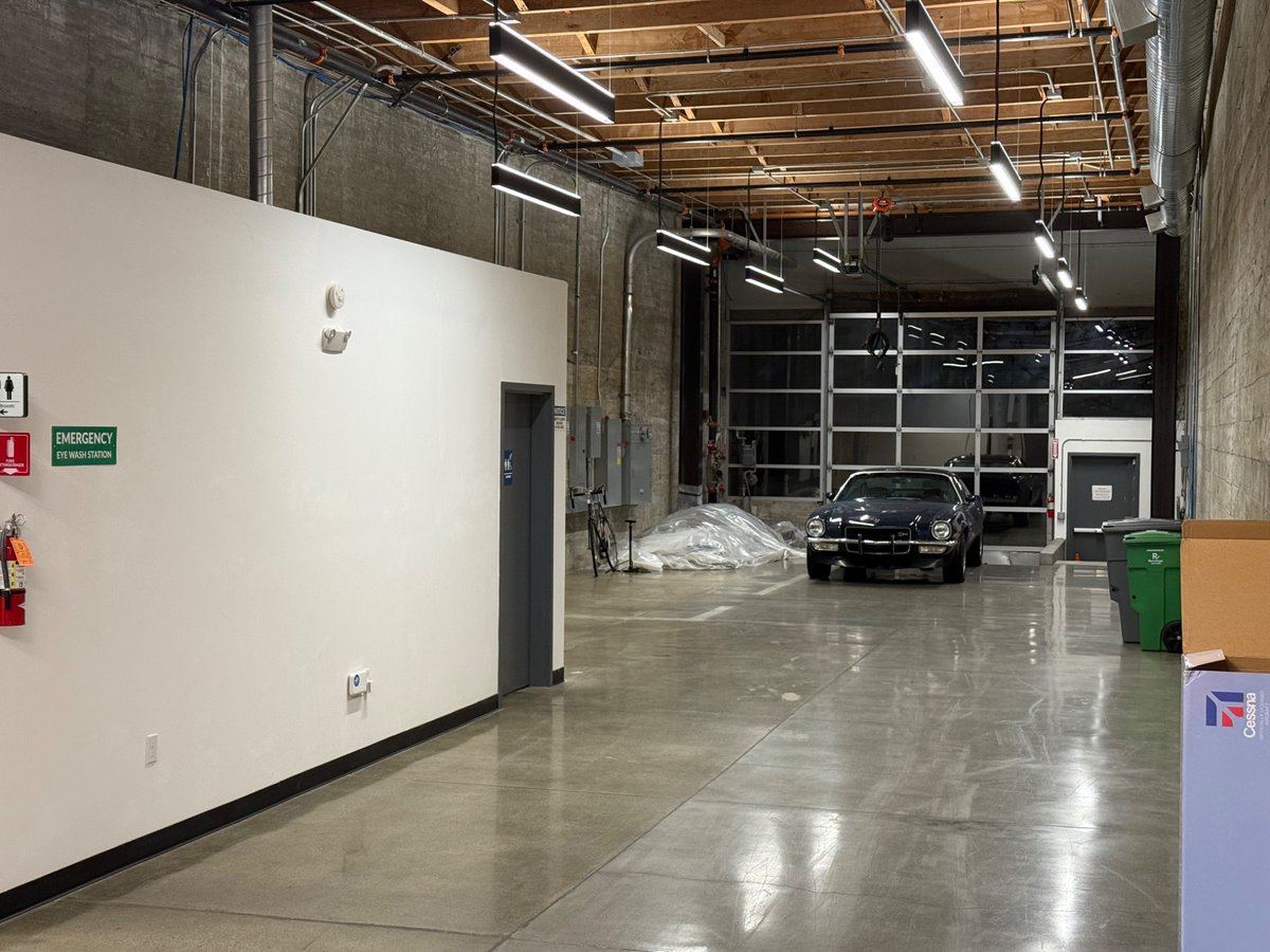CarlSchoeller's tweet photo. The Theseus version of the giant American flag in the warehouse https://t.co/1FARm1tn4B