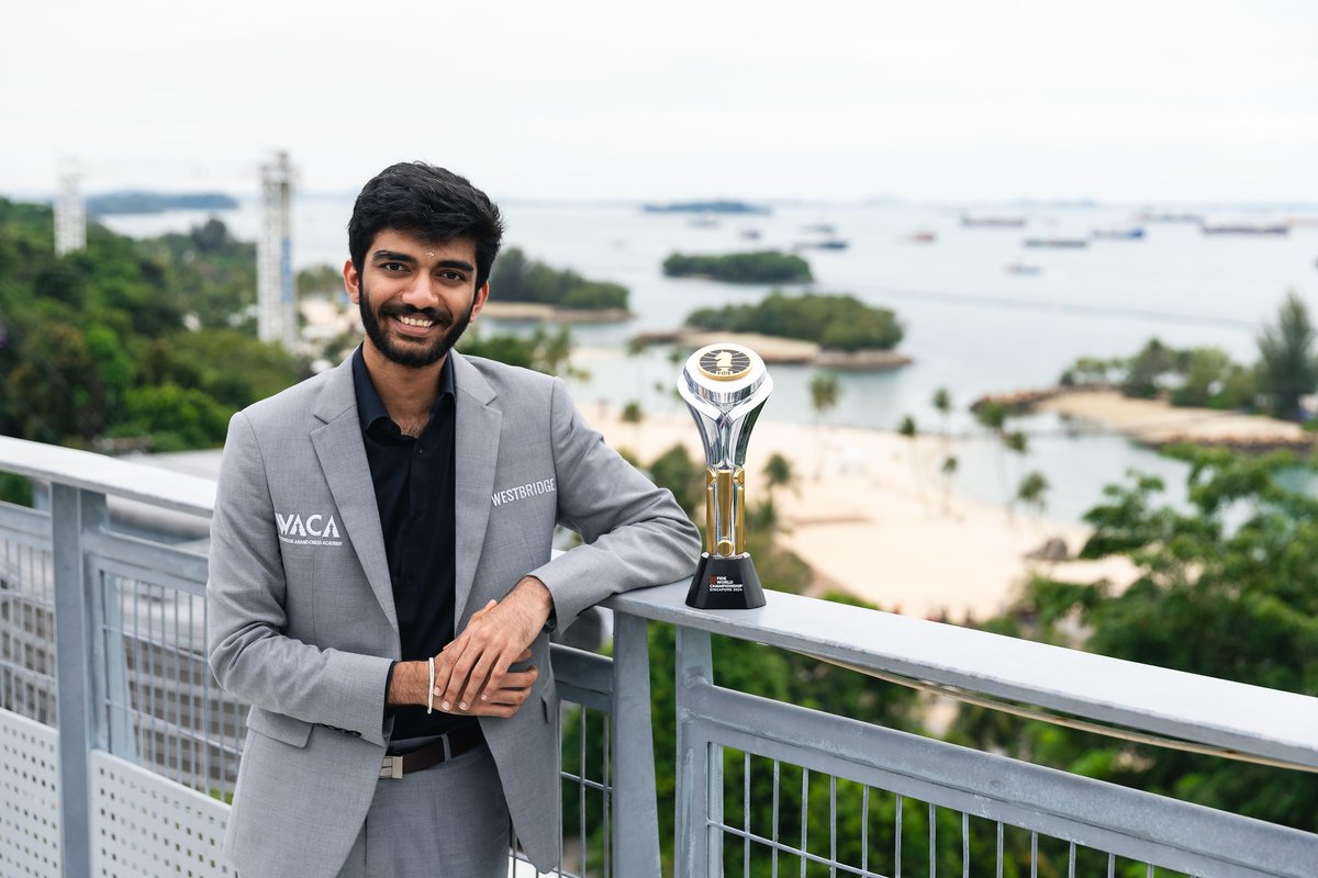 FIDE_chess's tweet photo. 🇮🇳 Gukesh D: 18 years old and next to the trophy that cements his place in history 🌟🏆 #DingGukesh

📷 Eng Chin An https://t.co/3sVPFYPxDD