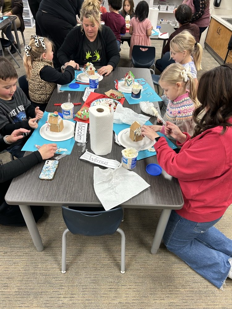 Lakeview Kindergarteners had a blast designing gingerbread houses with their caregivers! They learned about city planning, building permits, and even earthquake-proof gingerbread homes in Haiti. Sweet learning moments! #CanDoKid