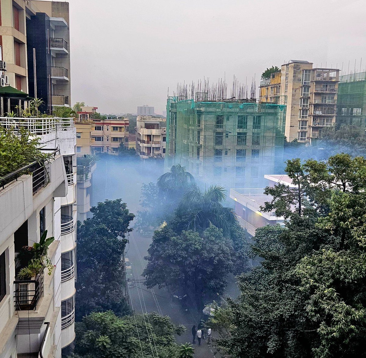 BerndSpanier's tweet image. The blue mosquito fumigation cloud as seen from our apartment - while it reduces the risk of catching dengue, there is a downside in terms of air quality #Dhaka #AirQuality #WearAMask