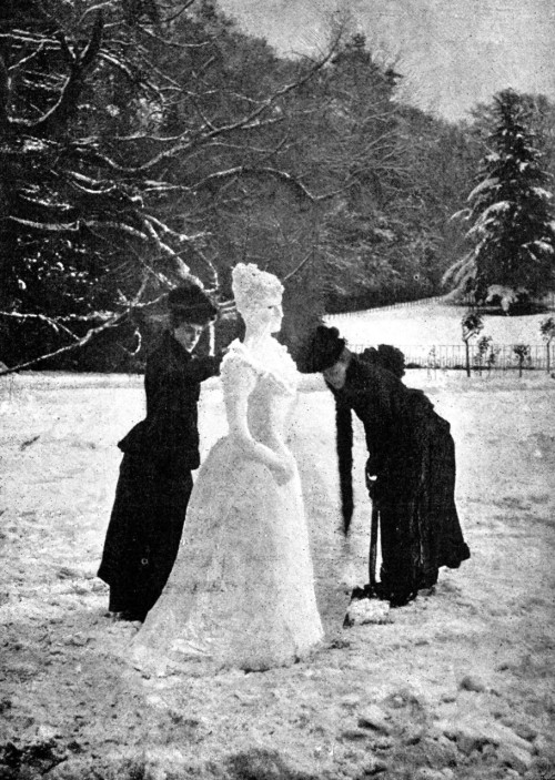 Two ladies making a snow lady. Photographed in 1891.