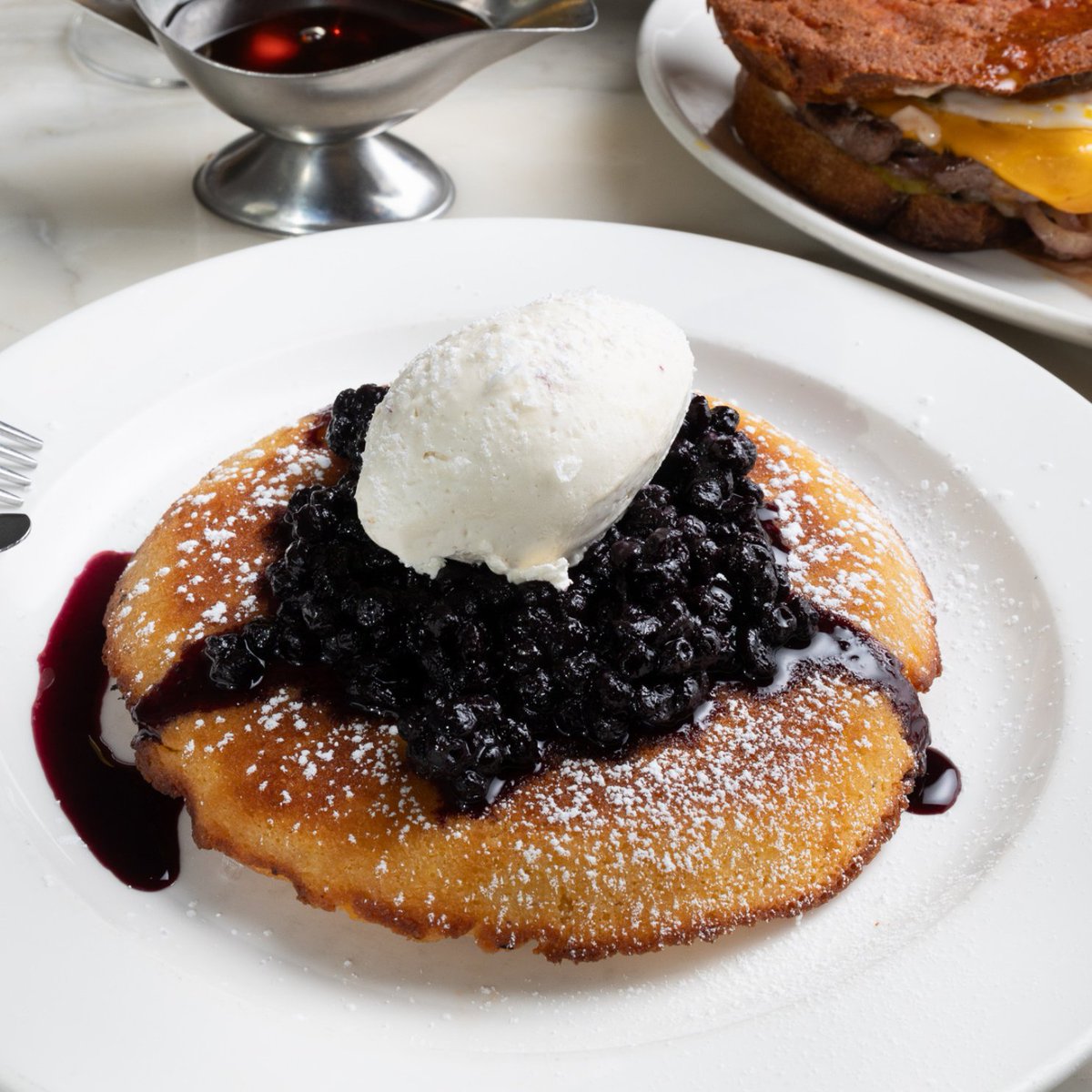 Weekend plans? Start your weekend with our cornmeal griddle cake this Saturday and Sunday at Homer St. Topped with preserved blueberries and whipped maple butter, it’s the perfect mix of comfort and indulgence.