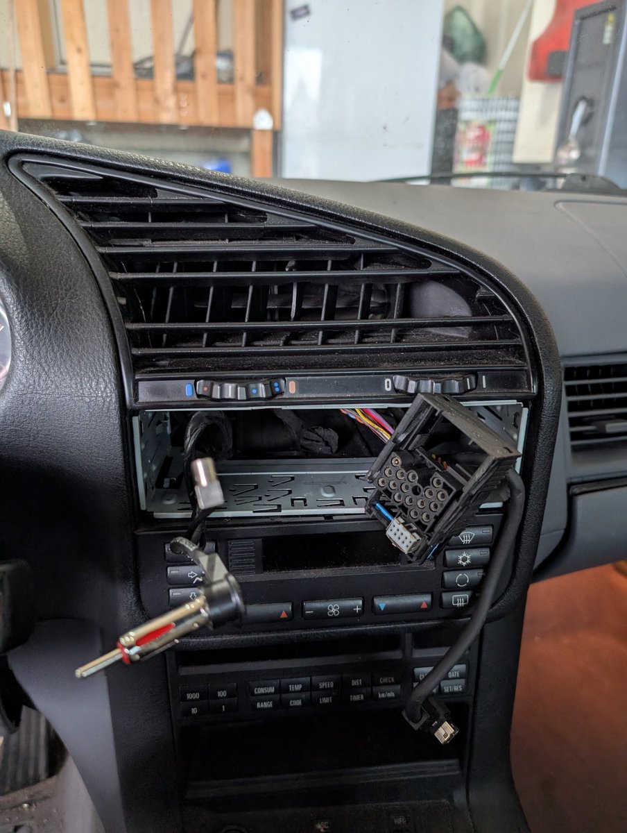 Yoinked out the M3's 2000's era Panasonic radio in preparation for getting a new radio