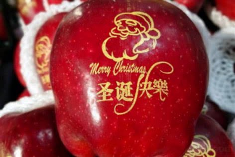 Apples have recently become a Christmas icon China. Exquisitely wrapped apples  with images of Santa Claus etc. Apples are everywhere, they are sold everywhere  from swanky shopping malls to the back of trucks at makeshift night markets. 
Pingguo,  a homophone for “peace fruit.”