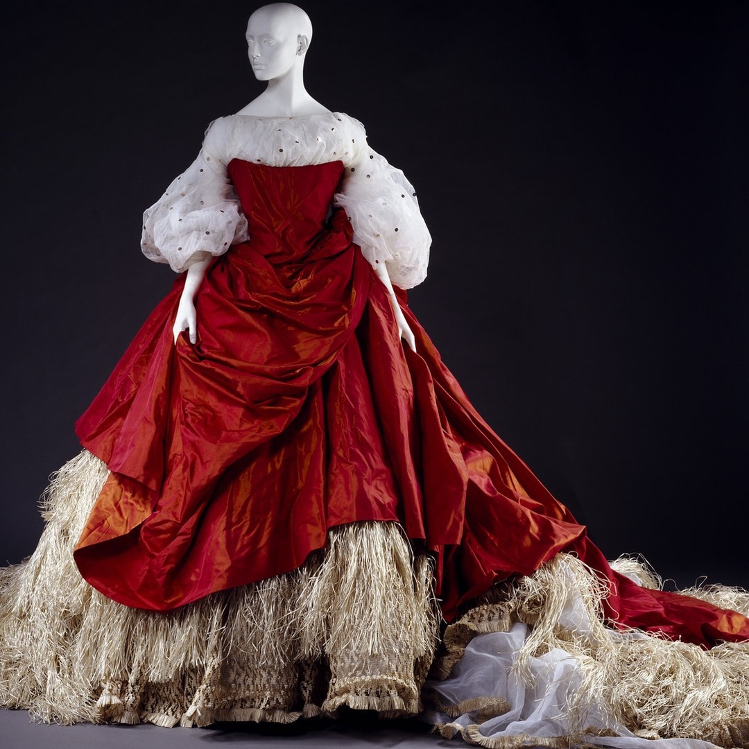 Wedding dress by Vivienne Westwood from her 1994 couture collection.​​​​​​​​​​​​​​​​​​A pioneer of punk and avant-garde fashion, redefined 1990s style with her bold, provocative designs.   Learn more about Vivienne Westwood at VFG Label Resource.  V&amp;A Museum