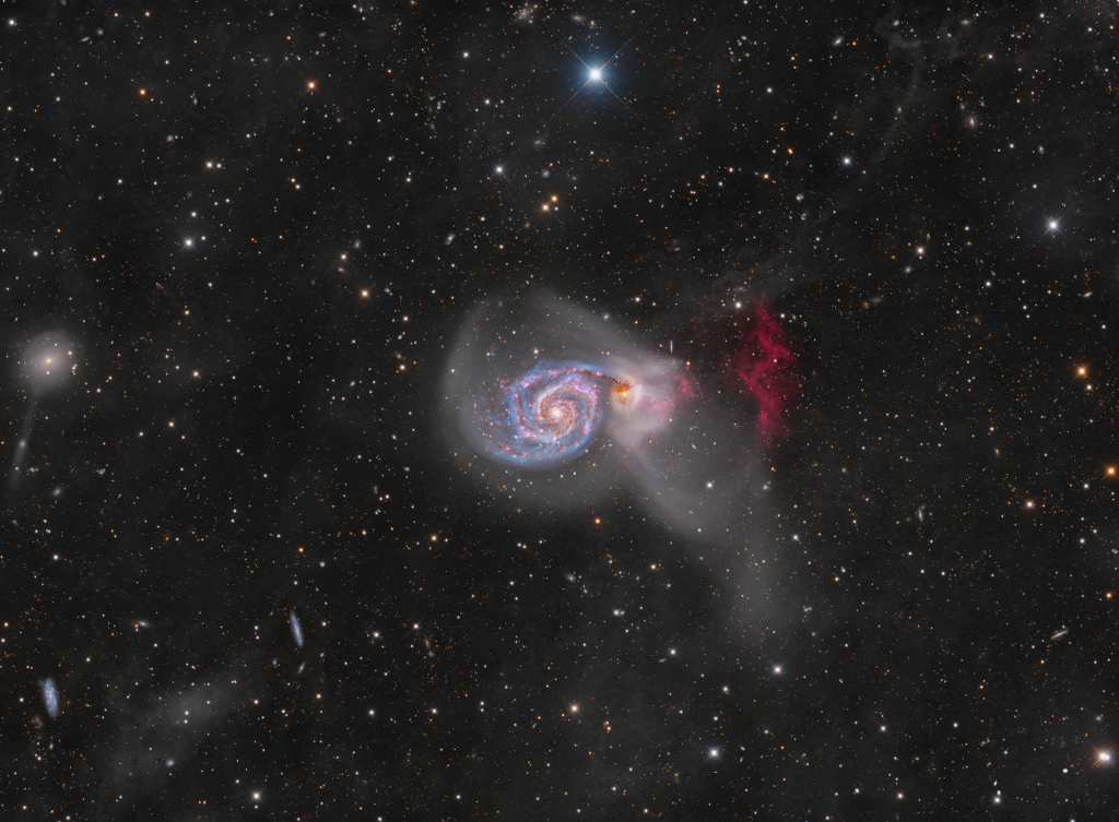 An intriguing pair of interacting galaxies, M51 is the 51st entry in Charles Messier's famous catalog. Perhaps the original spiral nebula, the large galaxy with whirlpool-like spiral structure seen nearly face-on is also cataloged as NGC 5194. Its spiral arms and dust lanes sweep