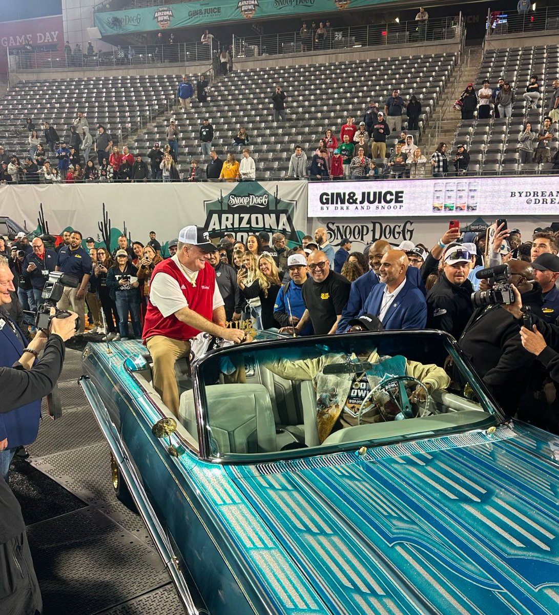 Hey <a href="/SnoopDogg/">Snoop Dogg</a> and can we get that ride to Oxford?

<a href="/Martin_Miami_HC/">Chuck Martin</a> rolling through campus on this whip would be 🔥

Lets make it happen 🤝

#RiseUpRedHawks <a href="/RedBrickLegacy/">Red Brick Legacy</a>