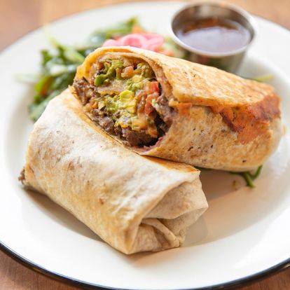 SOCALO BURRITO // mashed beans, griddled cheese, mexican coleslaw, guacamole, quemada salsa, served with green salad, choice of:
jackfruit tinga, chicken, pork, grilled steak 

#socalo #socalosantamonica #santamonica #eatlocal  socalo.com