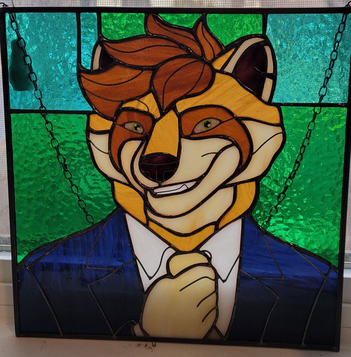 DapperRacc's tweet photo. One of the coolest gifts I've received. Artist is @scloglassstudio 

#furryartwork #stainedglass https://t.co/0zQfHESoSp