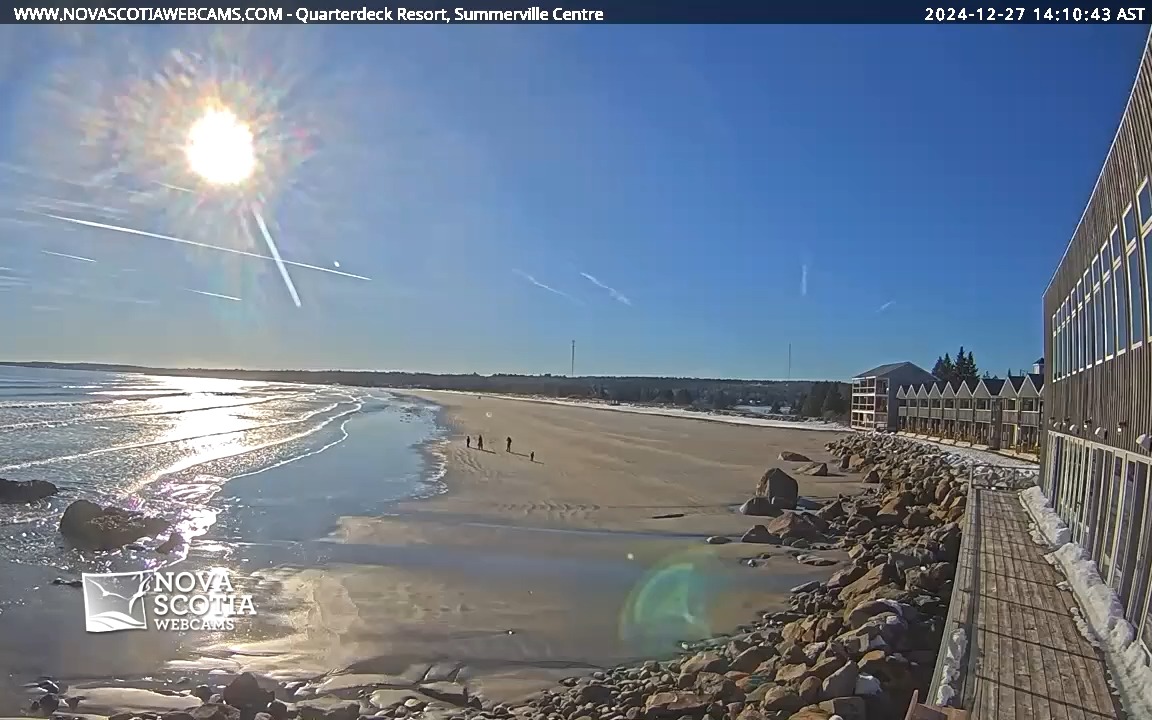 It's a lovely day for a stroll on the beach at The Quarterdeck Resort! 🏖️❄️ Tune in to this scene and many more, live at Nova Scotia Webcams 📸