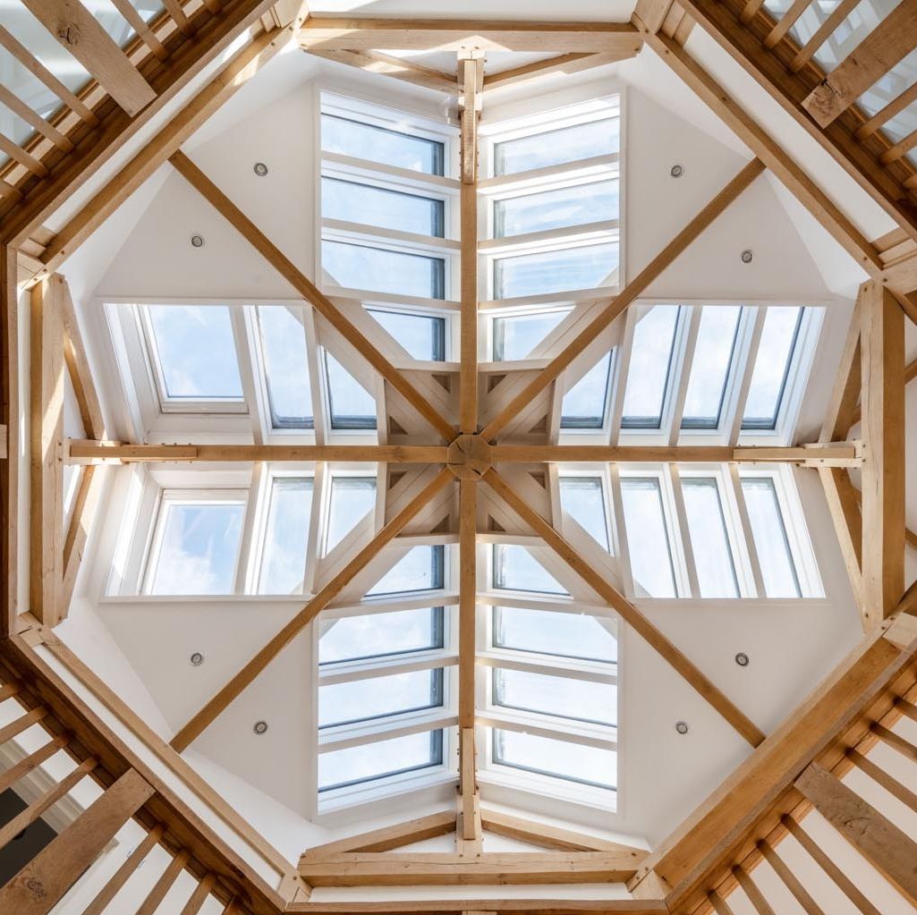 Carpenteroak's tweet photo. Featured on Channel 4’s Grand Designs, this home’s unique cross-shaped layout centers around an octagonal kitchen—an open-plan space perfect for socialising. A soaring void connects the kitchen to the galleried first-floor landing, crowned by a striking glazed roof lantern. https://t.co/qccRV7N18q
