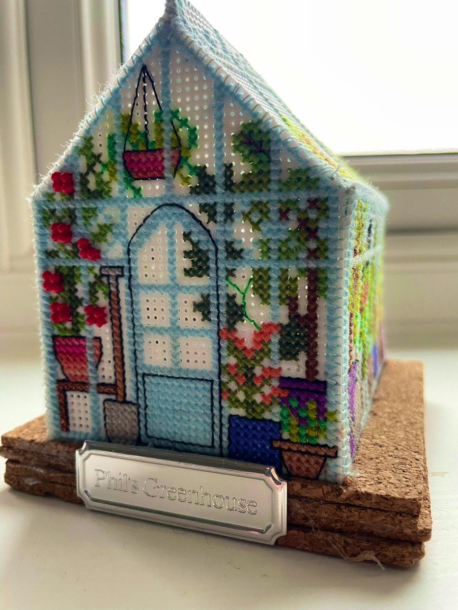 philskyross1962's tweet photo. My daughter spent a year creating a cross-stitch replica of my light blue greenhouse - complete with trailing Tomatoes, my favourite Amaranthus, hanging baskets &amp; my granddad’s spade retirement gift from 1970 which I treasure. Best Christmas present ever - made with love ❤️❤️❤️ https://t.co/HhzWkoBUN6