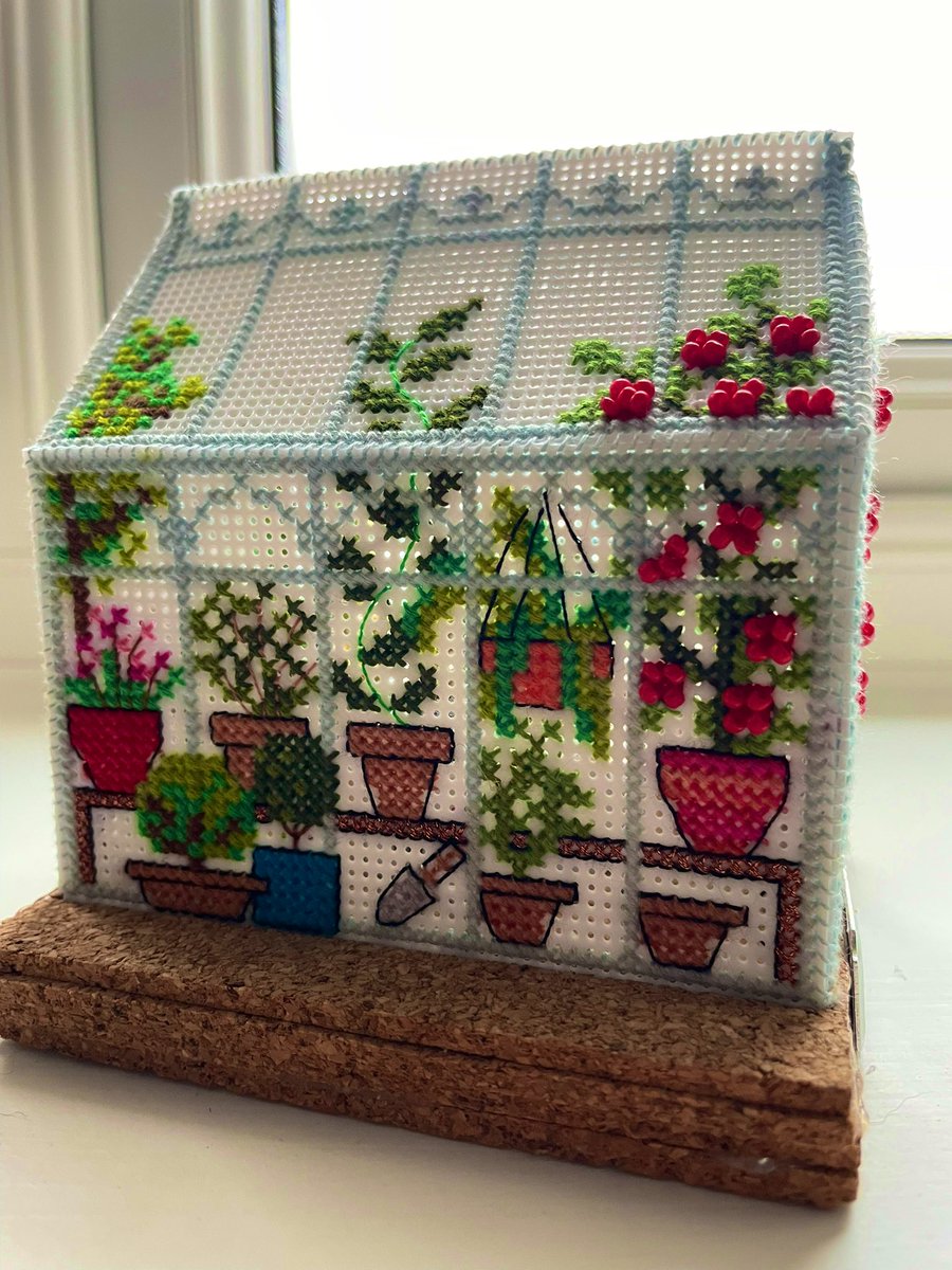 philskyross1962's tweet photo. My daughter spent a year creating a cross-stitch replica of my light blue greenhouse - complete with trailing Tomatoes, my favourite Amaranthus, hanging baskets &amp; my granddad’s spade retirement gift from 1970 which I treasure. Best Christmas present ever - made with love ❤️❤️❤️ https://t.co/HhzWkoBUN6