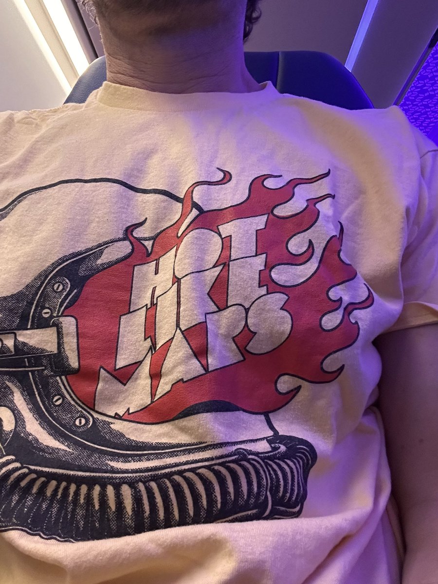 LangDang79's tweet photo. Can’t make the @HotLikeMarsBand show tonight so wearing the shirt on the plane. https://t.co/wV1WOEHeS7