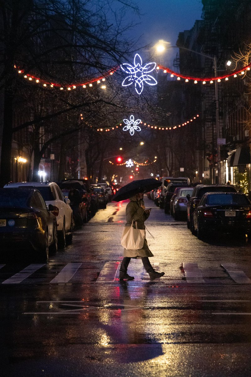 Soho in the rain—streetlights glowing and the city alive. Pure magic. #NYC