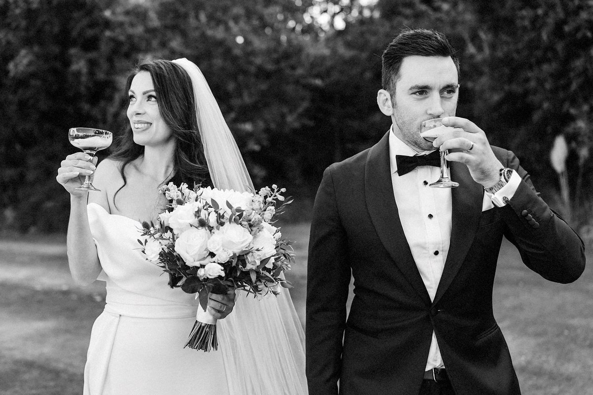 Now, I like these fancy little glasses, but it seems like a bit of a drawn out way of having a pint of Guinness. Each to their own though. #babyguinness #fancylittleglasses #blacktiewedding #documentaryweddingphotography #photojournalism <a href="/manorbythelake/">Manor By The Lake</a>