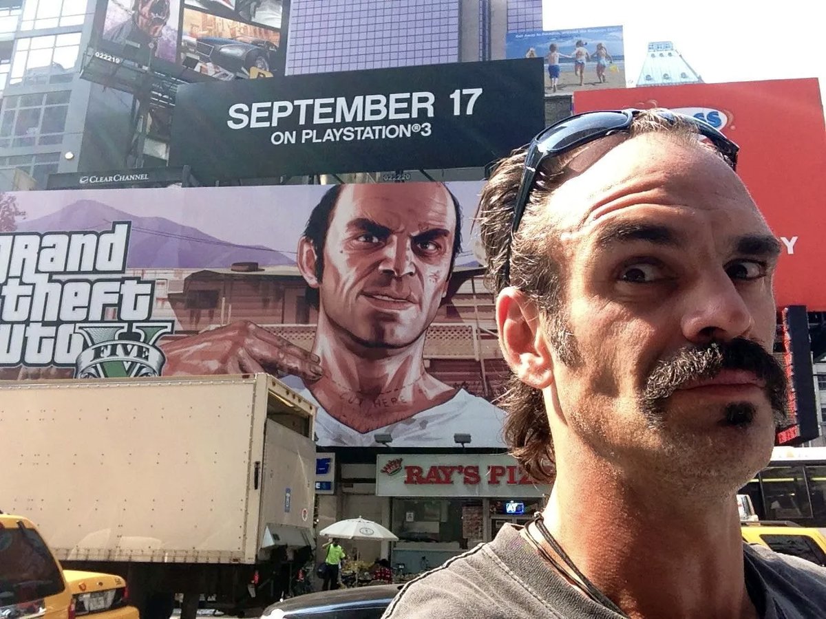 GTAVI_Countdown's tweet image. Iconic picture of GTA V’s Trevor actor, Steven Ogg posing in front of his billboard in Times Square, NYC (2013)