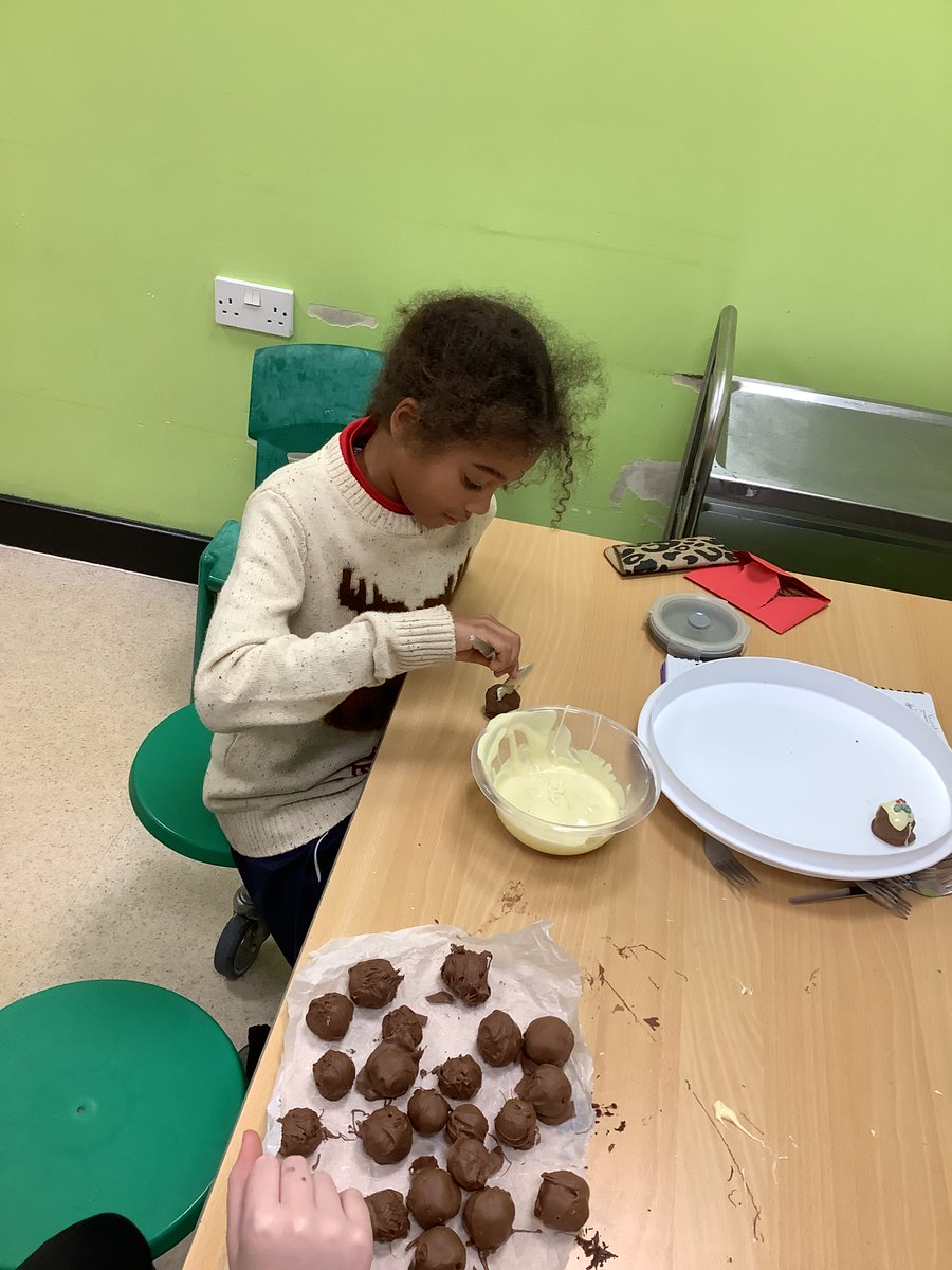 Baking Club:  The children made Christmas pudding truffles.