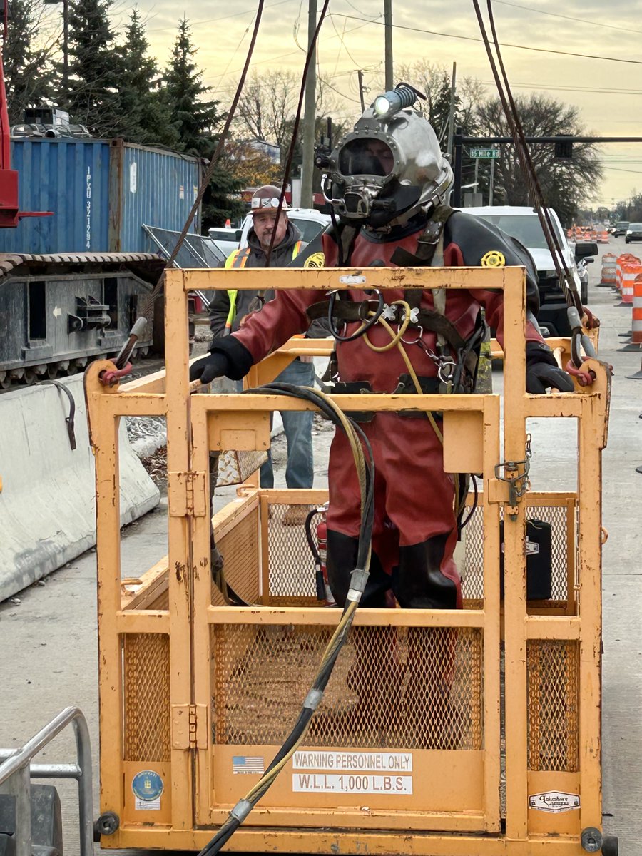 MillerMCPW's tweet image. A diver without a sea or lake?  In this case, he’s being lowered into a sewer system control structure to reach a major sewer line about 50 feet below the surface for spot maintenance. The Macomb Interceptor Drain conveys the sanitary flow of about 600,000 people.