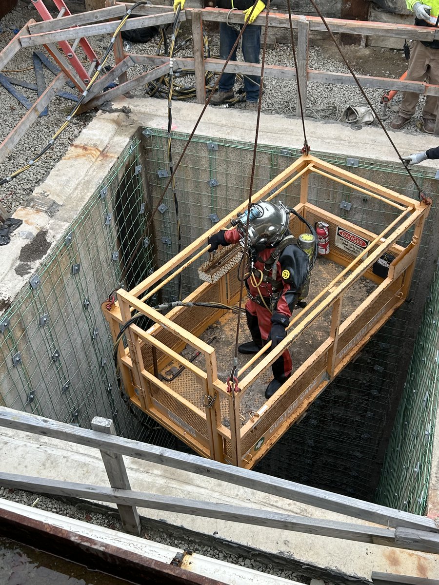 MillerMCPW's tweet image. A diver without a sea or lake?  In this case, he’s being lowered into a sewer system control structure to reach a major sewer line about 50 feet below the surface for spot maintenance. The Macomb Interceptor Drain conveys the sanitary flow of about 600,000 people.