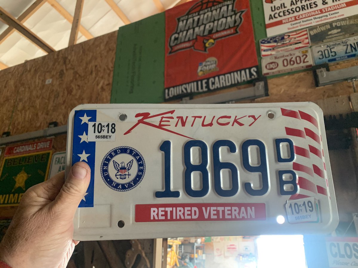 BluegrassBTP's tweet photo. Hung up my Dads last truck tags right beside the 2013 Natty Champ Flag #GoCards #RIPDad #USNavy #SubHunter https://t.co/QUbBEXKr3C