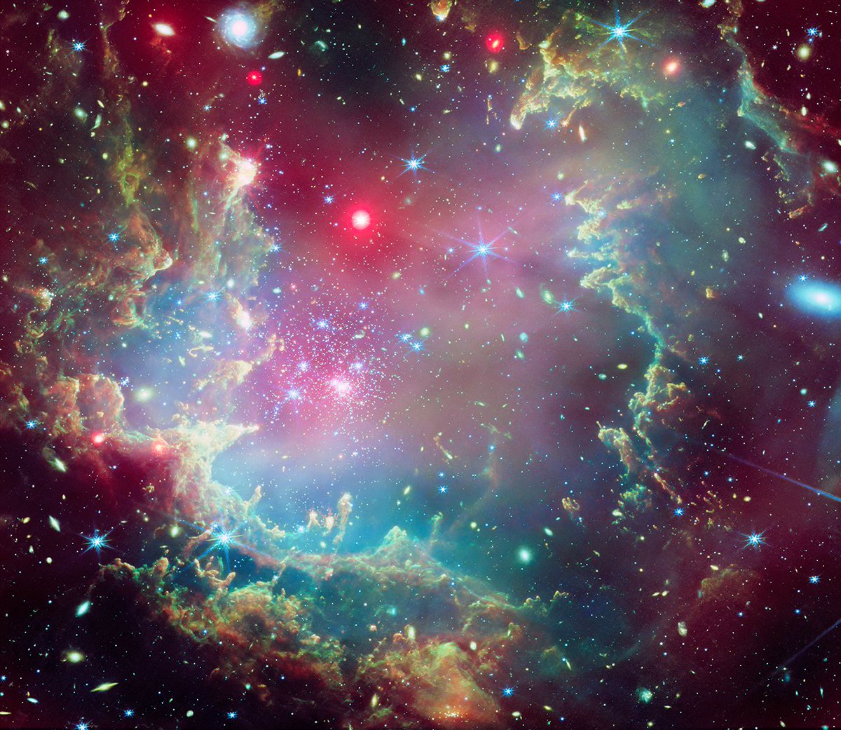 Chandra Observatory (@chandraxray) on Twitter photo Want this holiday wreath for your front door? You're going to need a bigger door. This new image of star cluster NGC 602 from Chandra & <a href="/NASAWebb/">NASA Webb Telescope</a> is about 175 light-years across and it sparkles with the light from thousands of stars.🎀 More: s.si.edu/wreath Want this holiday wreath for your front door? You're going to need a bigger door. This new image of star cluster NGC 602 from Chandra & <a href="/NASAWebb/">NASA Webb Telescope</a> is about 175 light-years across and it sparkles with the light from thousands of stars.🎀 More: s.si.edu/wreath