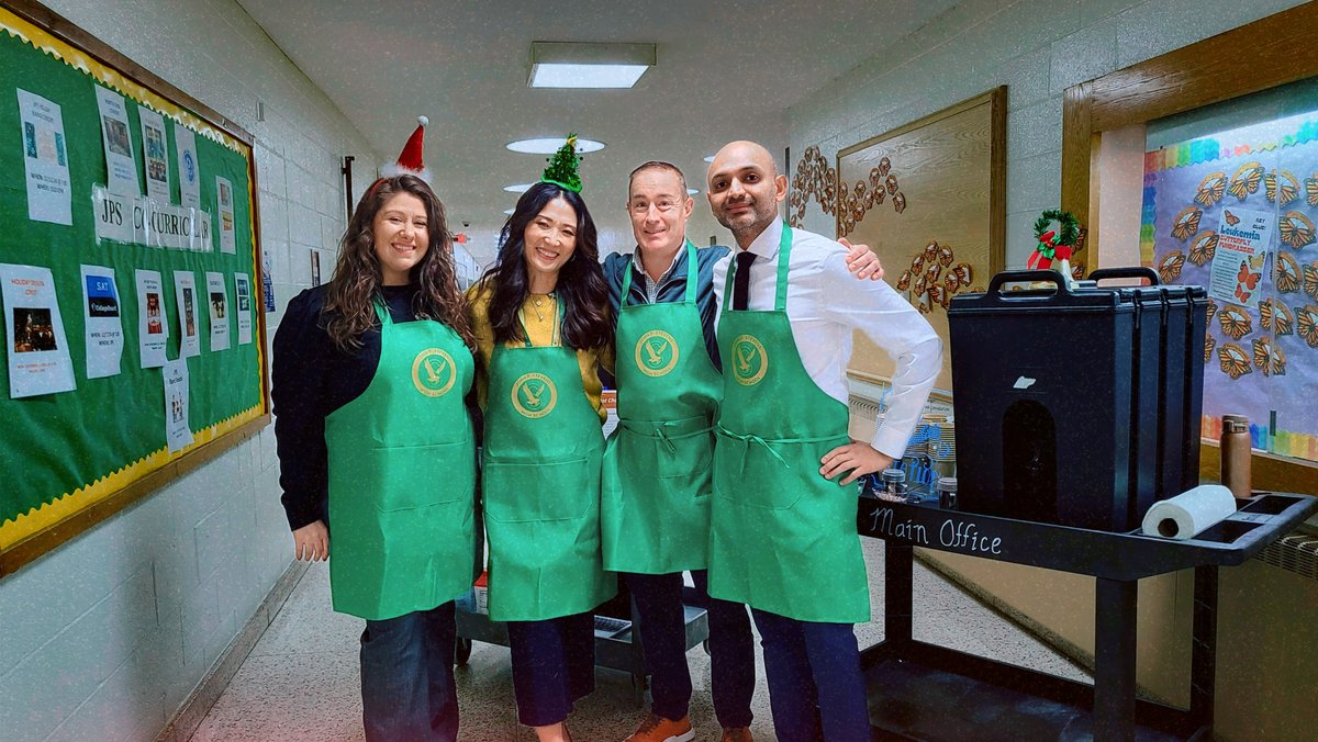 Leadership isn’t just decisions—it’s actions.
Dr. Kim brought a new tradition: hot chocolate for the entire staff. The JP admin team, green aprons and all, rolled through the halls, delivering cocoa, calories, and caffeine to keep the day going.