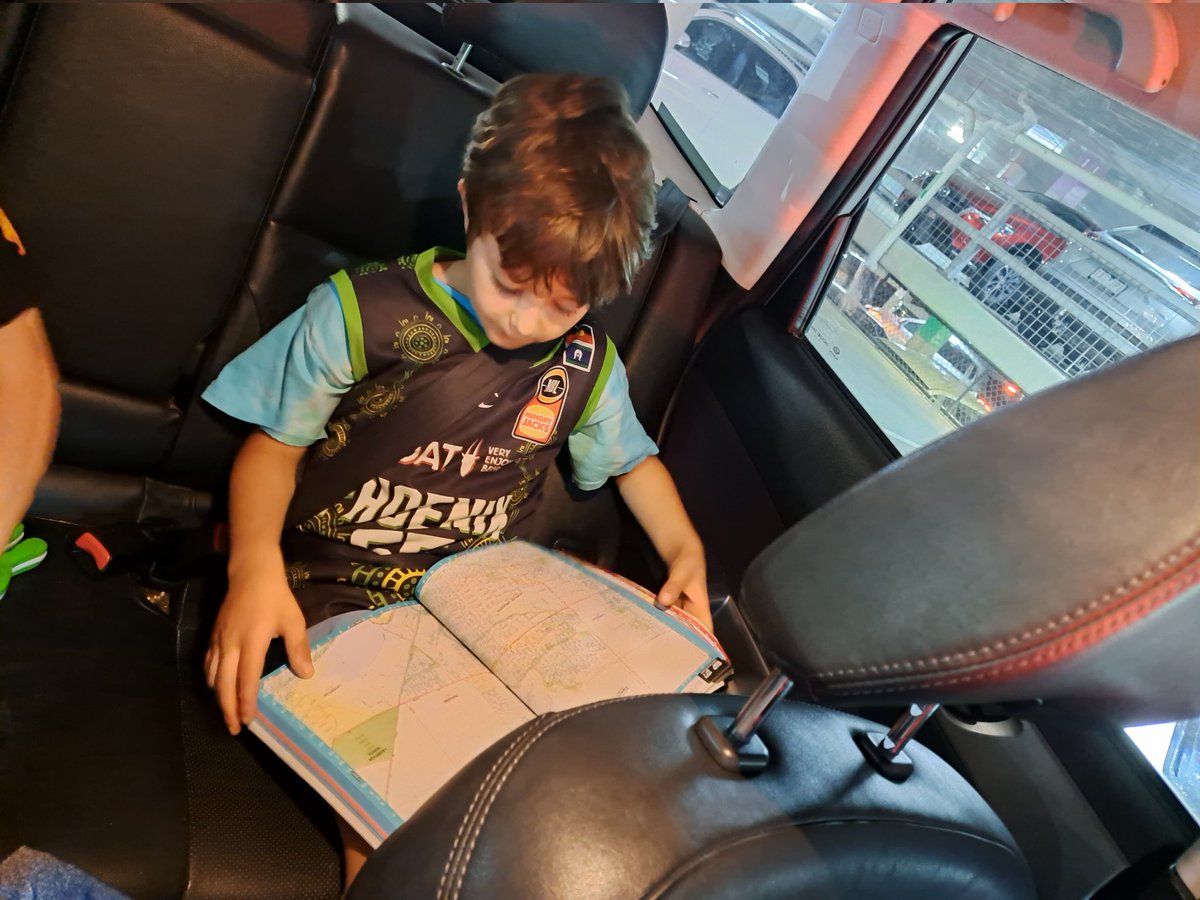 Driving around the other day and Isaiah shouts, "Look, sat-nav in a book!"