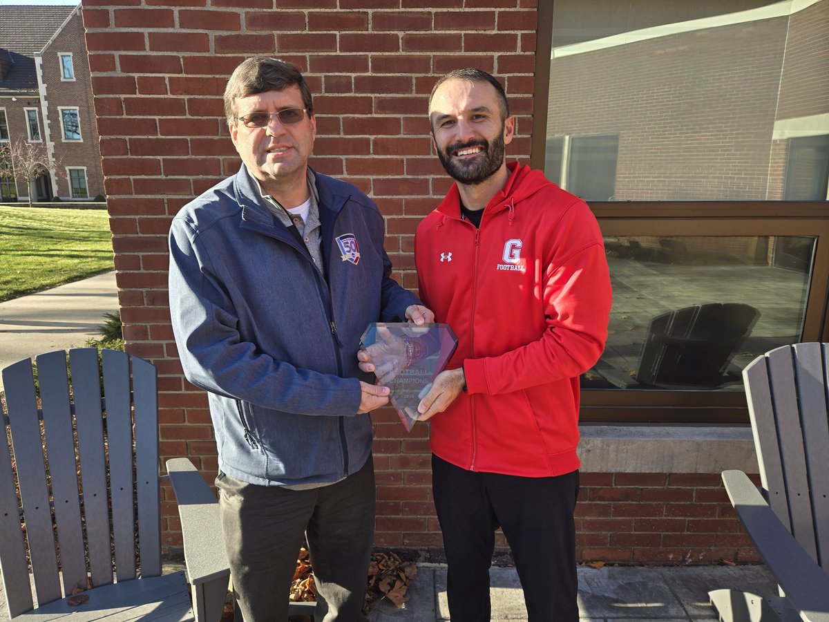 GCC_Wolverines's tweet photo. Multiple @PAC_Athletics champions means multiple trophies! Thanks to commissioner Joe Onderko for stopping by today with hardware for @GCC_FB and @CoachDiDonato! https://t.co/Tv5MwO55Yo