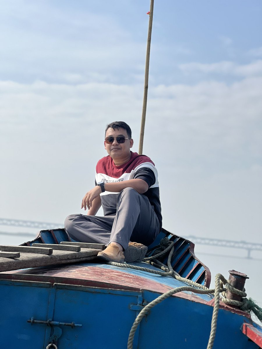 IMZedEmEn's tweet photo. “Yesterday, I drifted along the Padma, reaching a quiet sand char beneath the grand bridge, and as the river whispered of time’s flow, I felt it—beneath the years, the weight, and the layers—I am still just a boy chasing horizons.” https://t.co/bb9YMnUidf