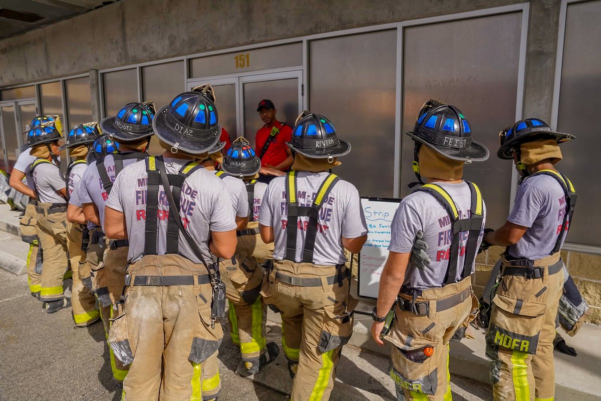 MiamiDadeFire's tweet photo. This week, #MDFRClass156 tackled firefighter survival training, facing real-world scenarios designed to test their skills and prepare them for challenges they may encounter in the field. Instructors guided recruits through situations such as being separated from their crew in a darkened room, finding exits blocked by fire or debris and navigating collapses.