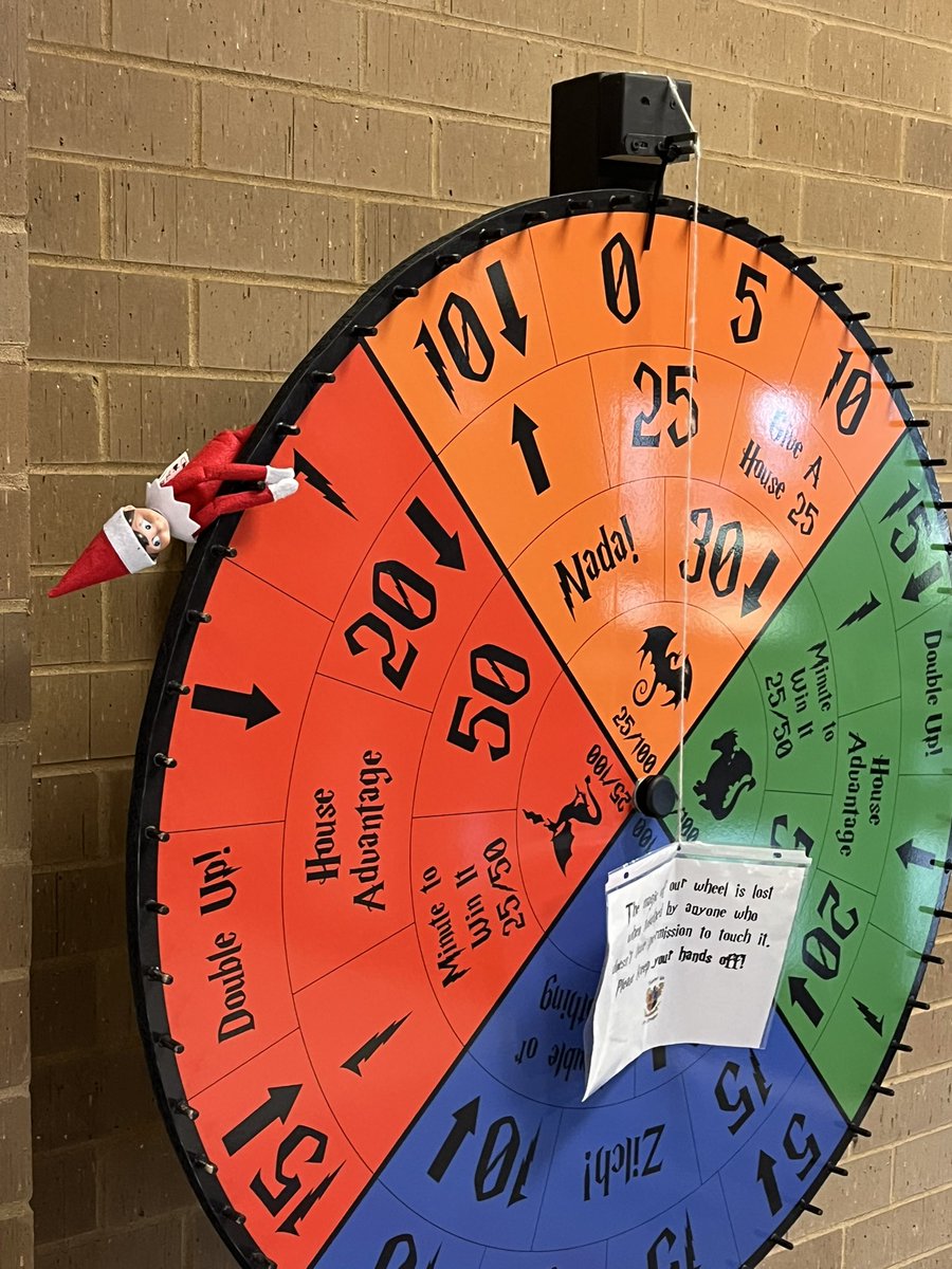 SCEMenierArt's tweet photo. Apparently the elf thinks if he has everyone’s chair waiting for them in the hall, that is helpful, and deserves a wheel spin. I think he might be confused. #SCEelf @SCE_Principals https://t.co/ou0JklmXEA