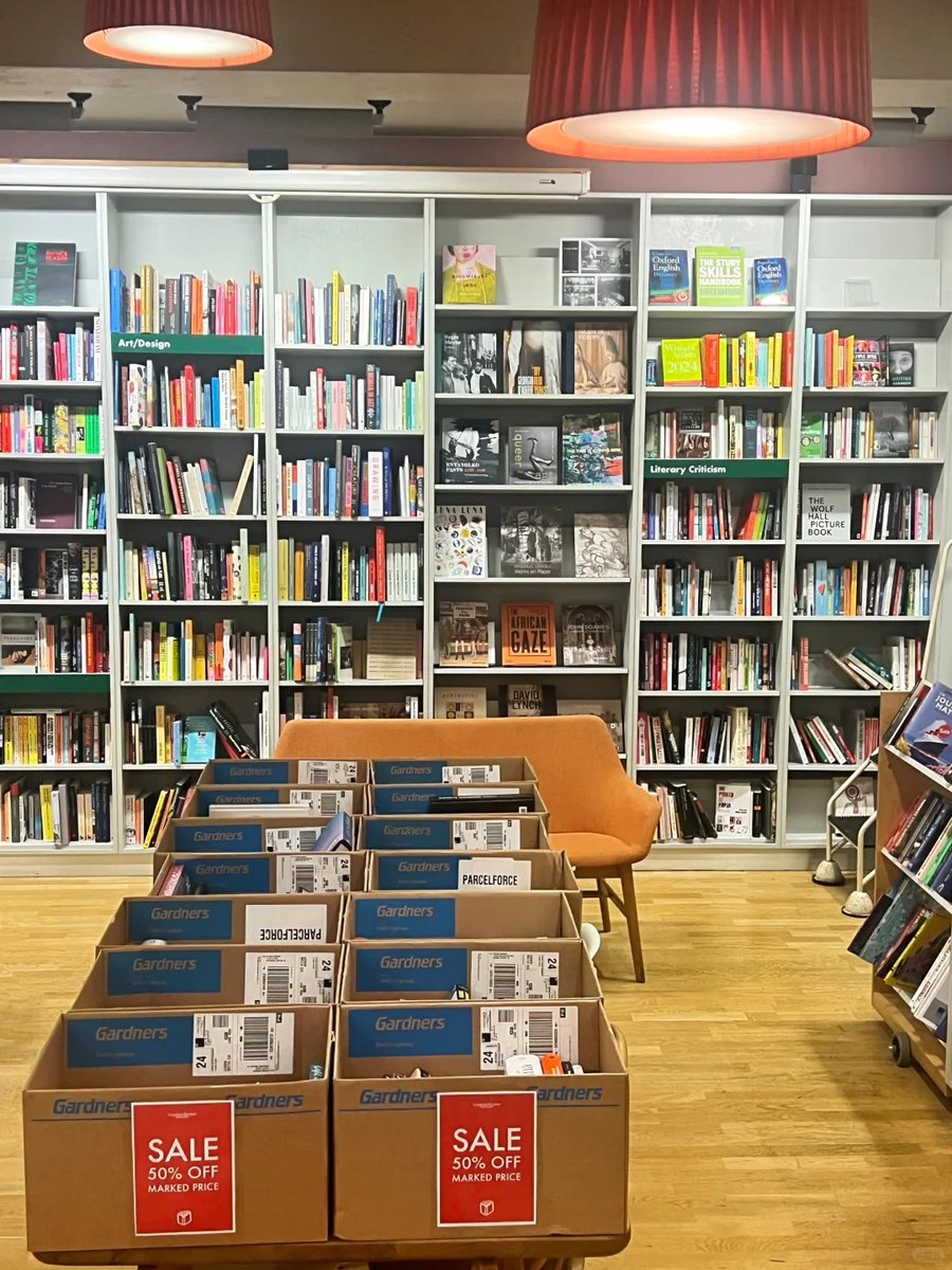 SilverthorneEsq's tweet photo. Display of Daunt Books tote bags alongside a selection of diverse book titles. https://t.co/1h9gvg8vui