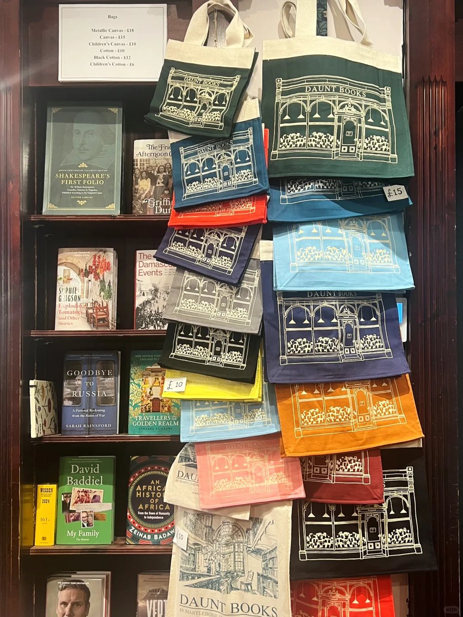 SilverthorneEsq's tweet photo. Display of Daunt Books tote bags alongside a selection of diverse book titles. https://t.co/1h9gvg8vui
