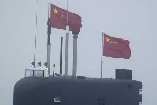 guille_farrell's tweet photo. Satellite imagery shows China's Type 094 nuclear sub with *open missile hatches*. A rare, deliberate message or routine maintenance? Either way, the signal is clear: tensions in the South China Sea are on edge. What comes next? 🌏⚠️ #China #MilitaryPosturing #SouthChinaSea #Geopolitics #WW3