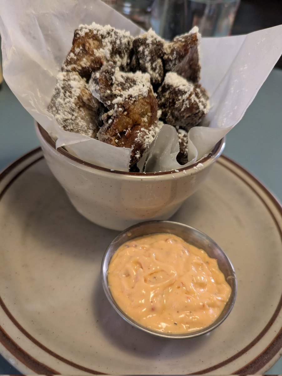 Crispy fried pork belly at Steuben's Uptown, a retro American restaurant in Denver serving comfort food classics.