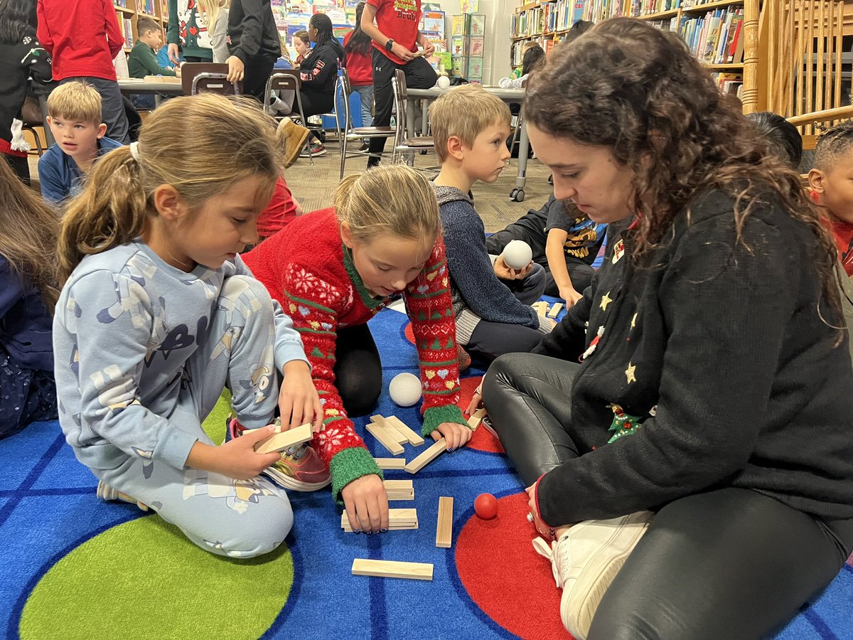 Our first and fourth grade classes had fun doing STEM activities together yesterday. They had to build and test ramps for different sized balls.