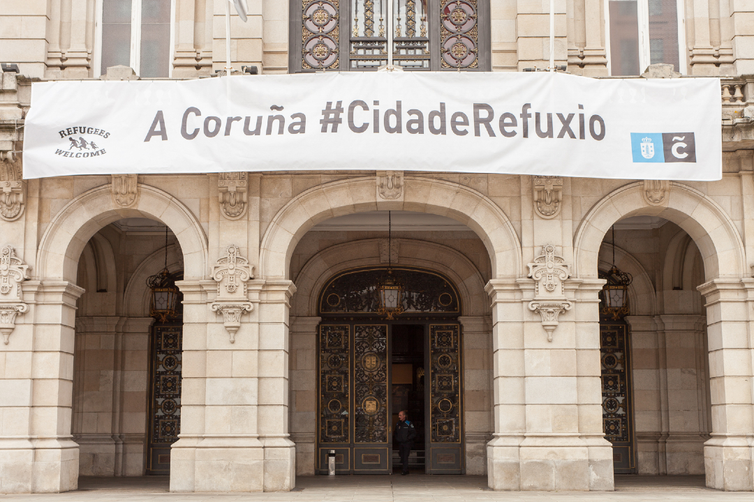 mareatlantica's tweet photo. No Día Internacional das Persoas Migrantes seguimos apostando por unha #Coruña acolledora. Durante o goberno da Marea Atlántica, A Coruña entrou na rede de cidades refuxio, e así debe seguir sendo.

Somos unha terra de emigrantes, e a diversidade enriquécenos. https://t.co/yxLBX8XHq2