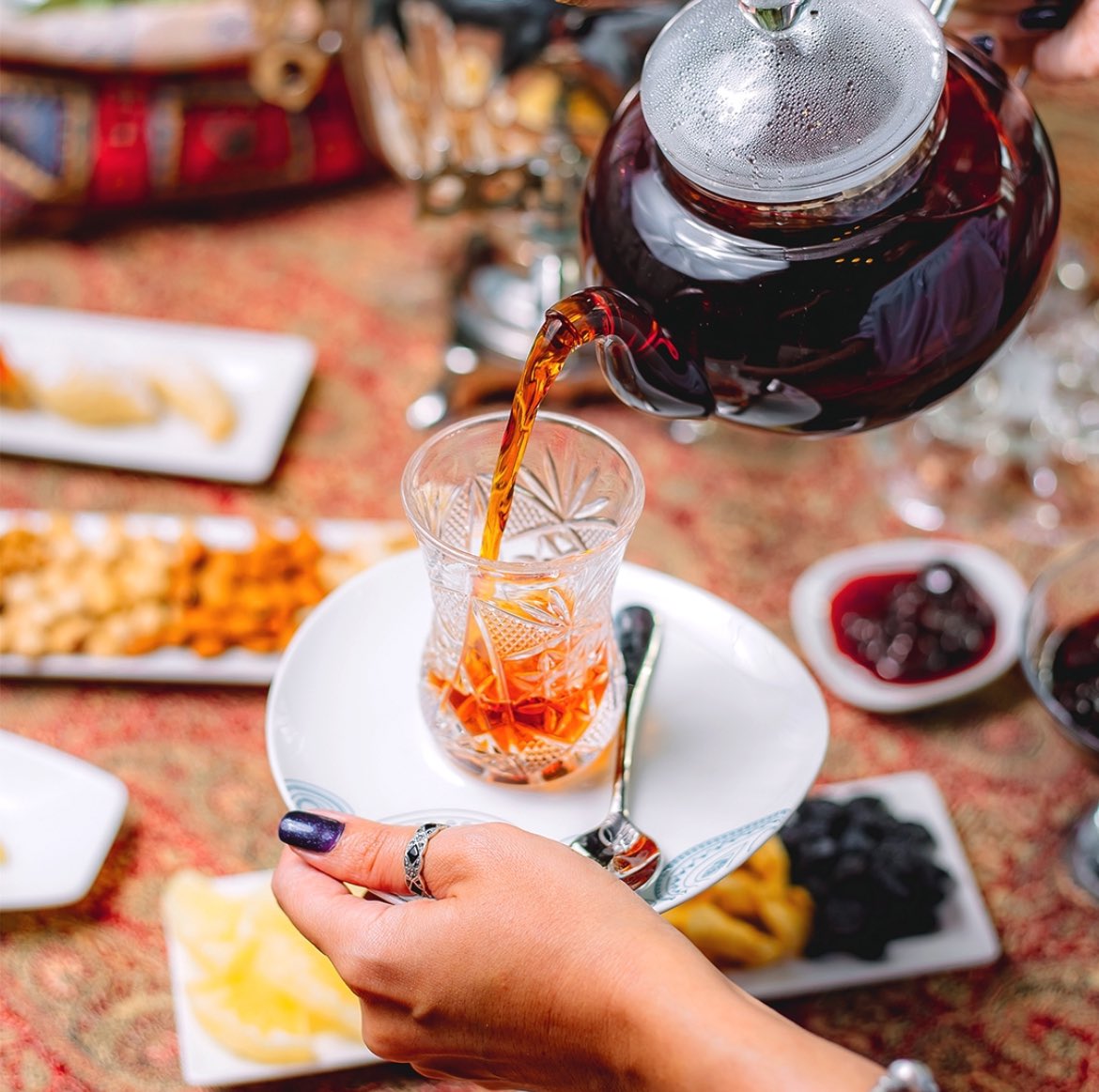 turkicplanet's tweet photo. Azerbaijani tea is not just a beverage; it’s an integral part of the country’s culture and daily life. Grown in the fertile lands along the Caspian Sea, particularly in the Lankaran and Astara regions, Azerbaijani tea has a rich history. However, the story of tea in Azerbaijan became more complicated under the rule of the Soviet Union. While the Soviets made large investments to increase tea production, they also heavily interfered with Azerbaijan’s traditional farming practices and culture.

The roots of Azerbaijani tea production were planted in the 1880s. In 1912, a farmer named M.O. Novoselov succeeded in cultivating tea, which led to the rapid expansion of Azerbaijan’s tea industry. However, after Azerbaijan fell under Soviet control, the growth of tea production was subjected to centralized Soviet planning. While tea production did increase, this growth came at the expense of local autonomy. The traditional farming methods and culture of the people were pushed aside as the Soviets took over control of the land.

The Soviet era may have brought tea production to its peak, but it also represented a period of loss for the Azerbaijani people. Tea, which could have been a source of local pride and cultural expression, was instead used primarily for economic gain by the Soviet authorities. Despite the economic benefits, the real cost was the suppression of local agricultural traditions and the loss of freedom over the land.

Tea in Azerbaijan is not just about the drink itself; it’s about tradition, hospitality, and building social bonds. Tea is often served to guests, and it’s common to find jam, lemon, and sometimes sugar accompanying the tea. The ritual of drinking tea reflects the warmth and generosity of Azerbaijani hospitality. Alongside tea, traditional sweets such as dried fruits, cookies, or sometimes “pakhlava” are served, further enhancing the experience.

Although tea production is currently limited, Azerbaijani tea still holds a special place in the country’s culture. It symbolizes the social ties within families, among friends, and even in business settings. In recent years, the Azerbaijani government has begun efforts to revitalize the tea industry, bringing this cultural treasure to international recognition once again. Tea, more than just a drink, serves as a reminder of Azerbaijan’s past, resilience, and its connection to the future. Today, Azerbaijani tea is not only appreciated for its taste but also for the cultural legacy it carries.