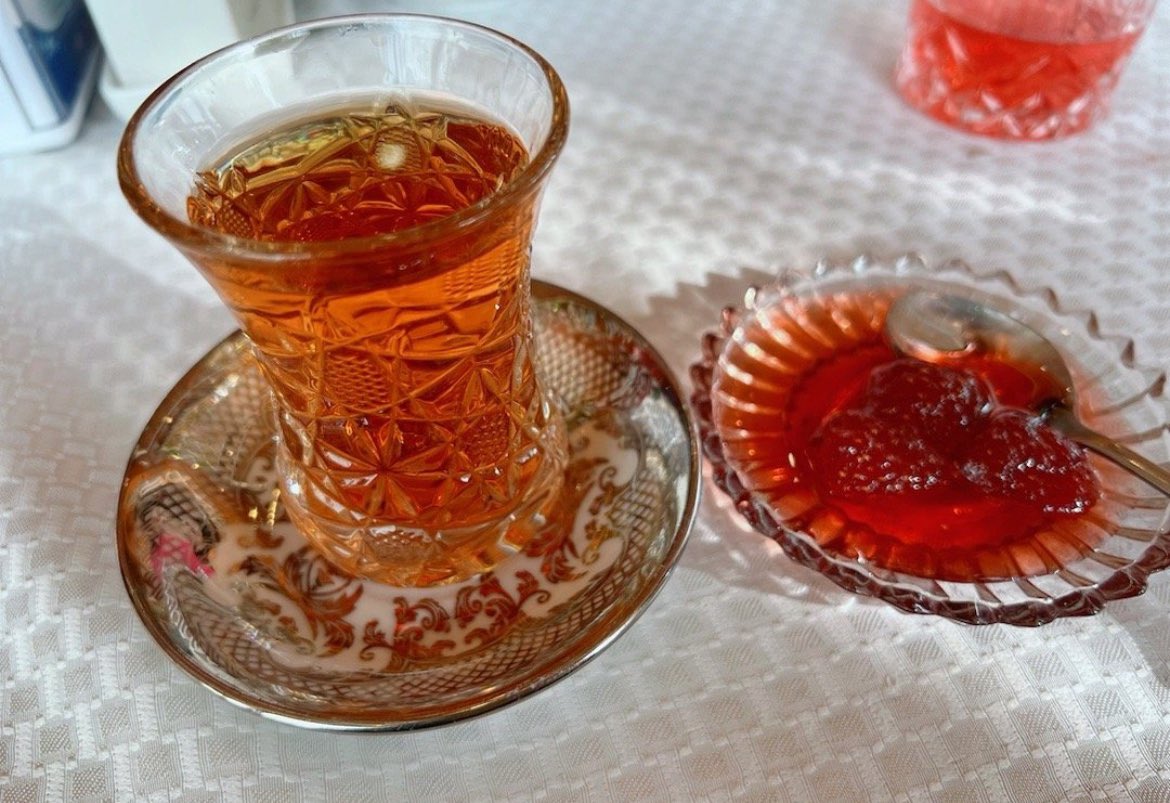 turkicplanet's tweet photo. Azerbaijani tea is not just a beverage; it’s an integral part of the country’s culture and daily life. Grown in the fertile lands along the Caspian Sea, particularly in the Lankaran and Astara regions, Azerbaijani tea has a rich history. However, the story of tea in Azerbaijan became more complicated under the rule of the Soviet Union. While the Soviets made large investments to increase tea production, they also heavily interfered with Azerbaijan’s traditional farming practices and culture.

The roots of Azerbaijani tea production were planted in the 1880s. In 1912, a farmer named M.O. Novoselov succeeded in cultivating tea, which led to the rapid expansion of Azerbaijan’s tea industry. However, after Azerbaijan fell under Soviet control, the growth of tea production was subjected to centralized Soviet planning. While tea production did increase, this growth came at the expense of local autonomy. The traditional farming methods and culture of the people were pushed aside as the Soviets took over control of the land.

The Soviet era may have brought tea production to its peak, but it also represented a period of loss for the Azerbaijani people. Tea, which could have been a source of local pride and cultural expression, was instead used primarily for economic gain by the Soviet authorities. Despite the economic benefits, the real cost was the suppression of local agricultural traditions and the loss of freedom over the land.

Tea in Azerbaijan is not just about the drink itself; it’s about tradition, hospitality, and building social bonds. Tea is often served to guests, and it’s common to find jam, lemon, and sometimes sugar accompanying the tea. The ritual of drinking tea reflects the warmth and generosity of Azerbaijani hospitality. Alongside tea, traditional sweets such as dried fruits, cookies, or sometimes “pakhlava” are served, further enhancing the experience.

Although tea production is currently limited, Azerbaijani tea still holds a special place in the country’s culture. It symbolizes the social ties within families, among friends, and even in business settings. In recent years, the Azerbaijani government has begun efforts to revitalize the tea industry, bringing this cultural treasure to international recognition once again. Tea, more than just a drink, serves as a reminder of Azerbaijan’s past, resilience, and its connection to the future. Today, Azerbaijani tea is not only appreciated for its taste but also for the cultural legacy it carries.