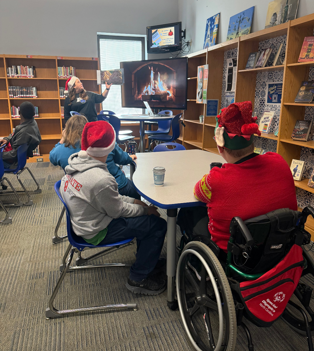 ParkwoodHSNC's tweet photo. Mrs. Williams loves having TTA join her each year for a reading of the Polar Express, hot chocolate and fun activities! #UCPSLibraryLife @AGHoulihan @UCPSNC https://t.co/TDoX8bcSI5