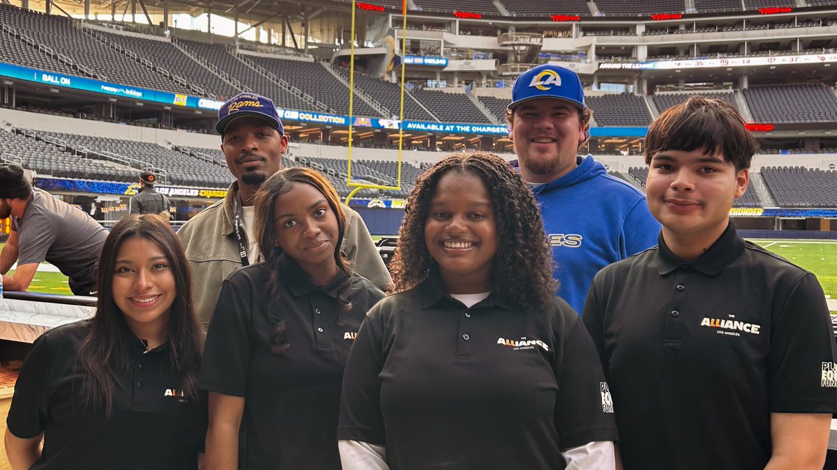 TheLAalliance's tweet photo. With the #labowl returning to Inglewood tonight, students from The Alliance paid a visit to SoFi Stadium to connect with staff and get their feet on the turf in our latest Career Lab. Thank you to the @RamsNFL, @sofistadium, and @labowlgame for the visit! #labowl https://t.co/QgkDuFv7L7