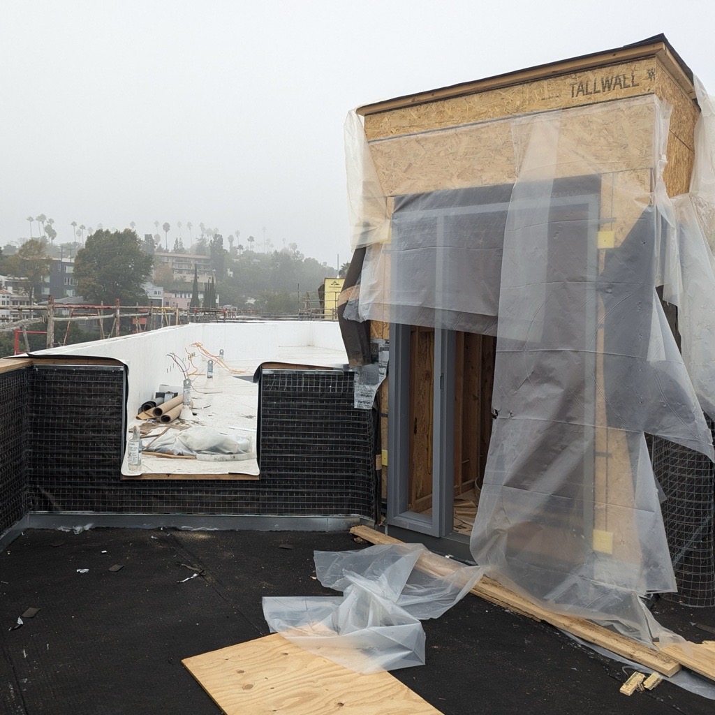 lahmonarch's tweet photo. Overcast skies at our Sunset project in Silverlake, but the stunning hillside views from the rooftop still shine through. Alpha Construction is framing one of the spiral staircases leading to the roof deck, beautifully illuminated by natural light even on this gloomy day. https://t.co/nGxw2TOnfn