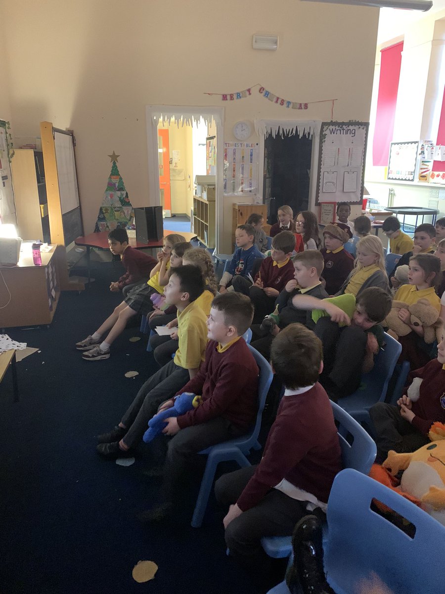 Primary 4 and 3 enjoying their smile treat with a movie and hot chocolate.